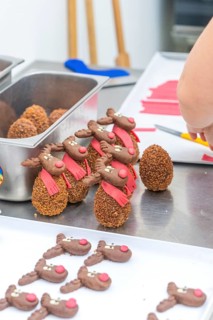 Placement of reindeer shaped chocolate chocolates on a work table, Christmas baking, Haselstaller