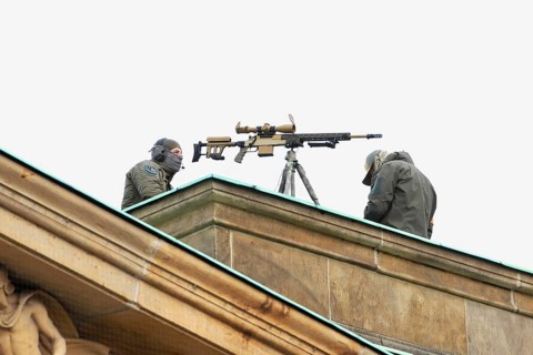 Police scope shooter on the roof of the new guard. - Memorial Day Wreath laying for victims of war