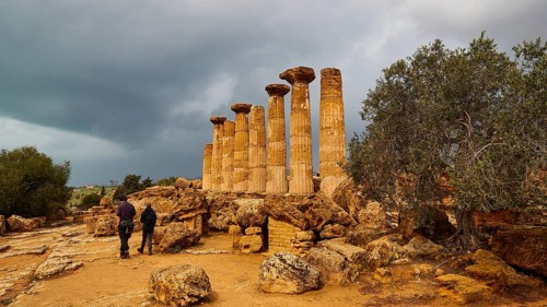 Heracles Temple, Ancient Column Ruins with Two People and Stormy Sky, Valley of the Temples, Valle
