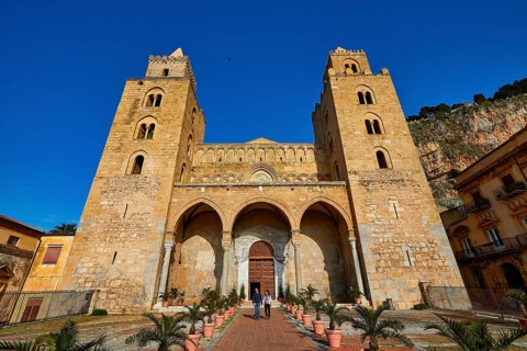 Impressive cathedral with main façade and symmetrical towers in clear skies, historic atmosphere,
