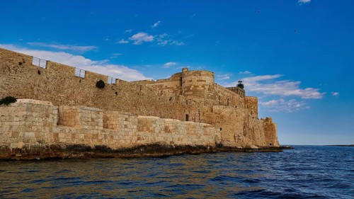 Syracuse, Ortigia island, sea fortress, extensive stone walls of an old fortress on the coast under