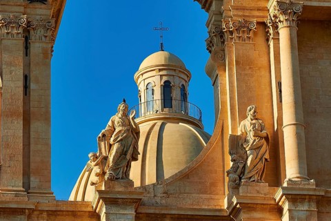Noto, detailed view of a cathedral with elaborate statues and architecture, Baroque towns of
