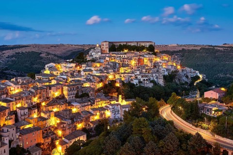 Ragusa, illuminated hill town view at dusk with atmospheric atmosphere, Baroque towns of Sicily,