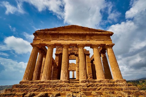 Temple of Concordia, imposing ancient temple with columns under a blue sky, Valley of the Temples,