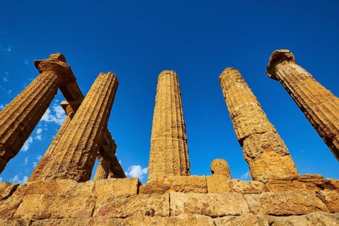 Temple of Hera, Temple of Juno, ancient, well-preserved columns against a bright blue sky, Valley