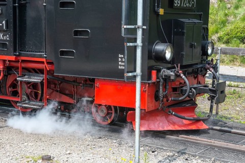 Front of a steaming locomotive, steam locomotive, railroad, railroad locomotive, detail, close-up,