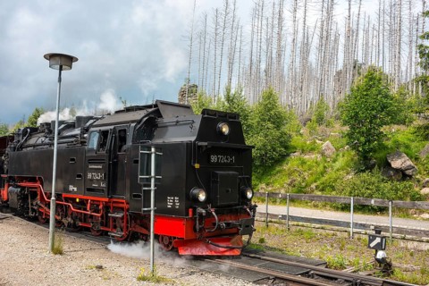 Close-up of a steam locomotive, rails, front of a steaming railway locomotive, steam locomotive,