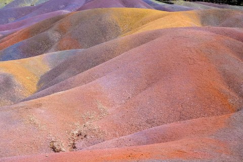 Rolling hills of colored sand form a unique landscape in rainbow colors. Africa, East Africa,