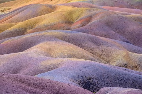 Colourful wavy hills that offer a surreal sight in purple and yellow. Africa, East Africa,