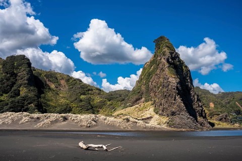 Landscape in New Zealand with sandy beach. Karekare Beach and The Watchman Rock. Karekare,