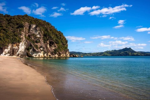 Landscape with sea and sandy beach in New Zealand. Lonely Bay, Shakespeare Cliff, Cooks Beach,