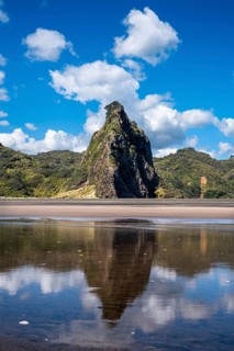 Landscape in New Zealand with sandy beach. Karekare Beach and The Watchman Rock. Karekare,