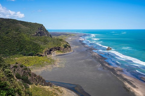 Landscape in New Zealand with sea and sandy beach. View of Karekare Beach and Whakaruro Bay beaches