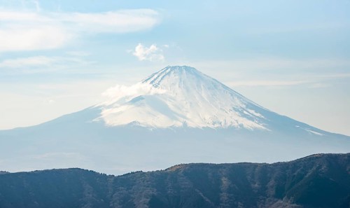 Snow-covered summit of Mount Fuji volcano in spring, Owakudani, Hakone, Japan
