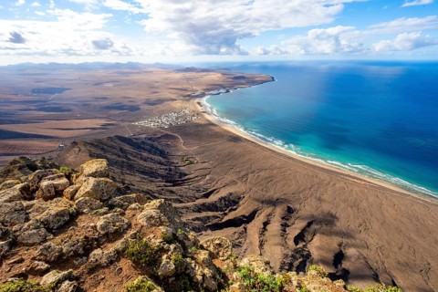 Castillejo viewpoint, view from the Risco de Famara cliffs to the coast and the sea with Famara