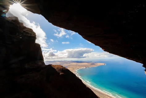 Cueva de las Cabras cave, view from the Risco de Famara cliffs to Famara beach, Playa de Famara
