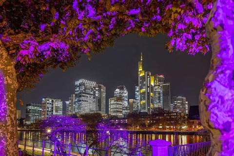 The lights of Frankfurt's banking skyline glow in the evening, Frankfurt am Main, Hesse, Germany