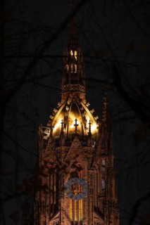 The top of St. Bartholomew's Cathedral in Frankfurt am Main glows like a crown in the evening,