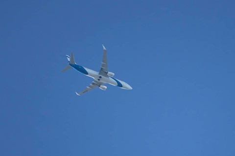 Boeing 737 jet passenger aircraft of El Al Israel airlines flying in a blue sky, England, United