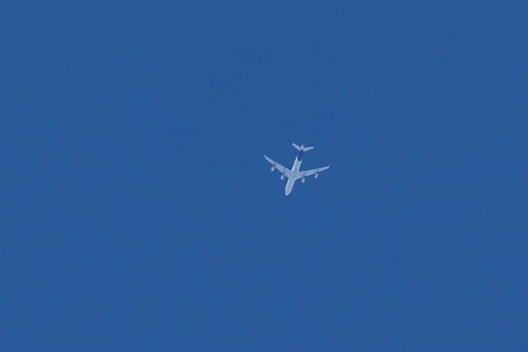 Airbus A340 jet passenger aircraft of Lufthansa airlines flying in a blue sky, England, United
