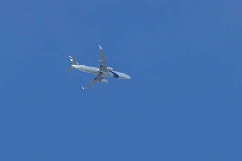 Boeing 737 jet passenger aircraft of El Al Israel airlines flying in a blue sky, England, United