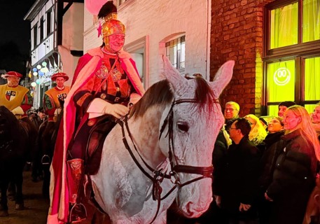 St. Martin on a white horse train in Alte Schulstraße in the evening, Altstadt, Kempen, Lower