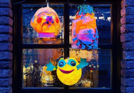 Homemade lanterns for the Martin procession in front of a window in the evening, Old Town, Kempen,