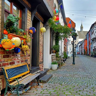 Tiefstraße decorated for Martin's procession with the tower of St. Peter's Church, Kempen, Lower