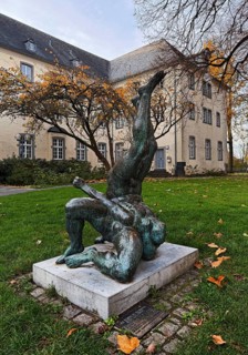 Sculpture entitled Wrestling Group by Jo Jastram in front of the former Kempen Franciscan monastery