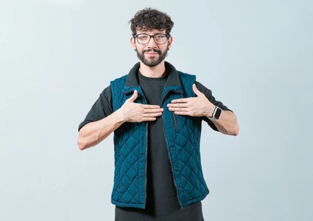 Person gesturing GRATITUDE in sign language. Guy making gesture GRATEFUL in sign language isolated