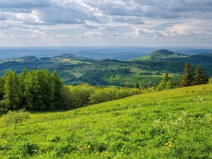 View from the summit of the Wasserkuppe over the hills of the Rhön to Milseburg, Gersfeld, Hesse,