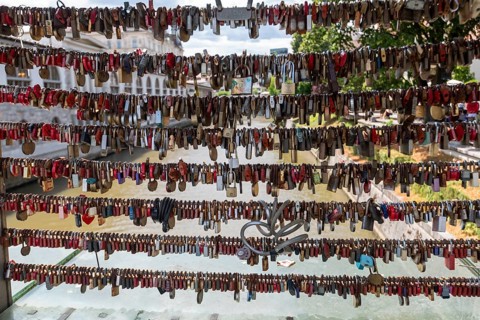 Love locks hang in several rows on the railing of the Mesarski Most (butcher's bridge) over the