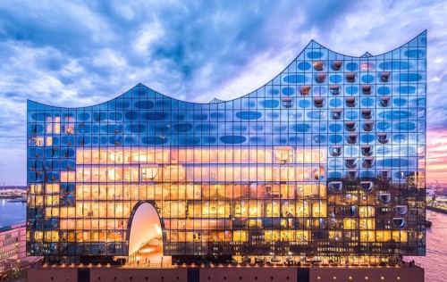 Aerial view of the Elbe Philharmonic Hall with reflections on the façade in the evening light above