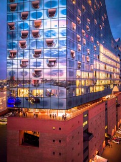 Aerial view of the Elbe Philharmonic Hall with reflections on the façade in the evening light above