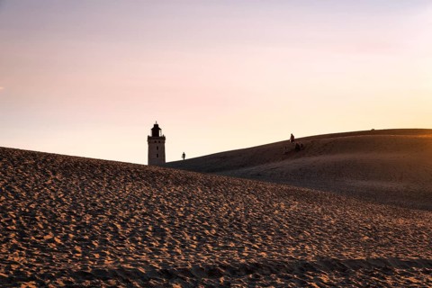 Rubjerg Knude lighthouse, walkers on hiking dune, evening mood in summer, Løkken, Lokken,