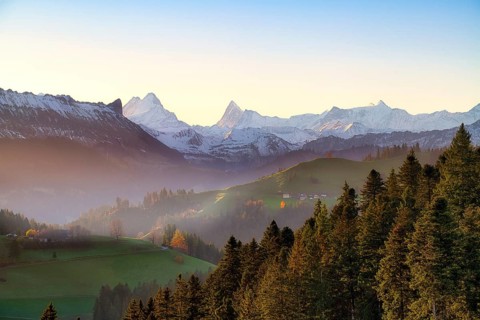 View of snow-covered Bernese Alps with Schreckhorn and Finsteraarhorn at sunrise, Langnau im