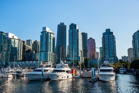 Sailing boats in marina, skyscrapers on the promenade, Coal Harbour, Vancouver, British Columbia,