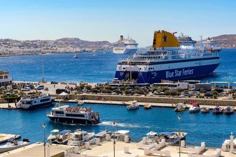 Mykonos, Cyclades, Greece - Mykonos New Port, a Blue Star Ferries ferry, is located on the quay in