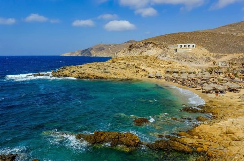 Mykonos, Cyclades, Greece - Ftelia Beach, Ftelia Beach, sandy beach on a windy rocky coast in the