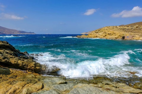 Mykonos, Cyclades, Greece - Ftelia Beach, Ftelia Beach, sandy beach on a windy rocky coast in the