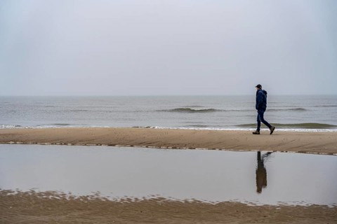 East beach of the East Frisian island of Spiekeroog, beach walk, man alone on the beach, at low