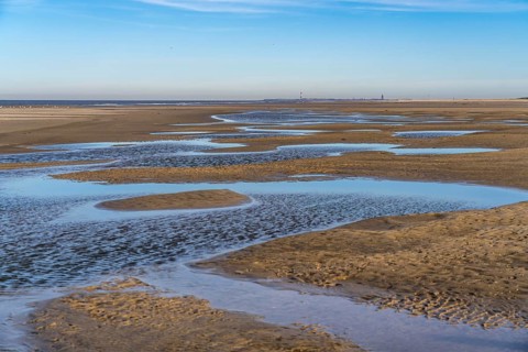 East beach of the East Frisian island of Spiekeroog, at low tide, tidal creek, watercourse at low