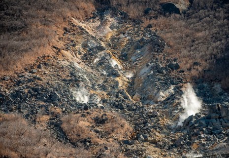 Steaming fumaroles in the Owakudani geothermal area at Komagatake volcano, Hakone, Japan