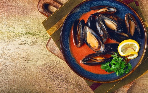 Fra Diavolo mussels, mussels in tomato sauce, Italian dish, on the table, top view, homemade, no