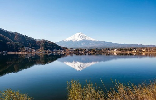 Volcano Mt. Fuji is reflected in Lake Kawaguchi, Yamanashi Prefecture, Japan