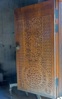 Detailed wooden door with cross engraving and ornaments, Tatev monastery, Tatev, Armenian Apostolic