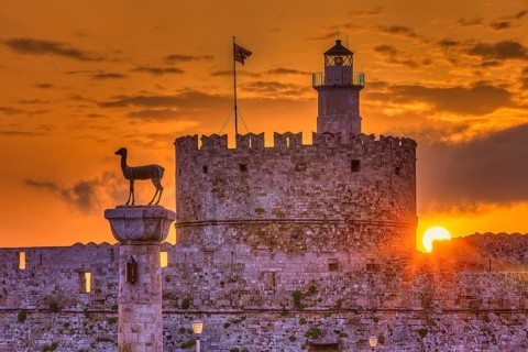 Agios Nikolaos fortress, castle and statue at sunrise with emotional and peaceful atmosphere,