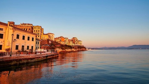 Picturesque coastal town at sunrise with reflection in water, UNESCO World Heritage Site, Old Town
