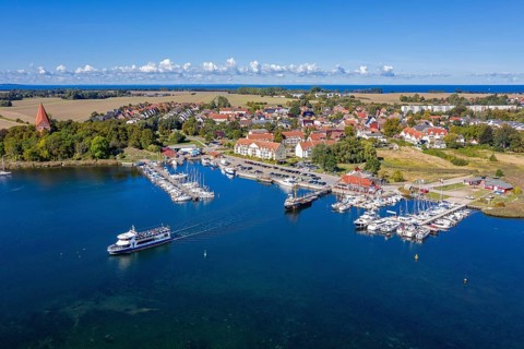 Aerial view over sailing boats in the harbour, marina of the village Kirchdorf in the Bay of