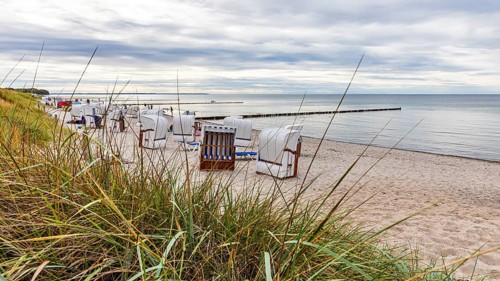 Beach with beach chairs on Schwarzen bush on the island of Poel on the Baltic Sea,